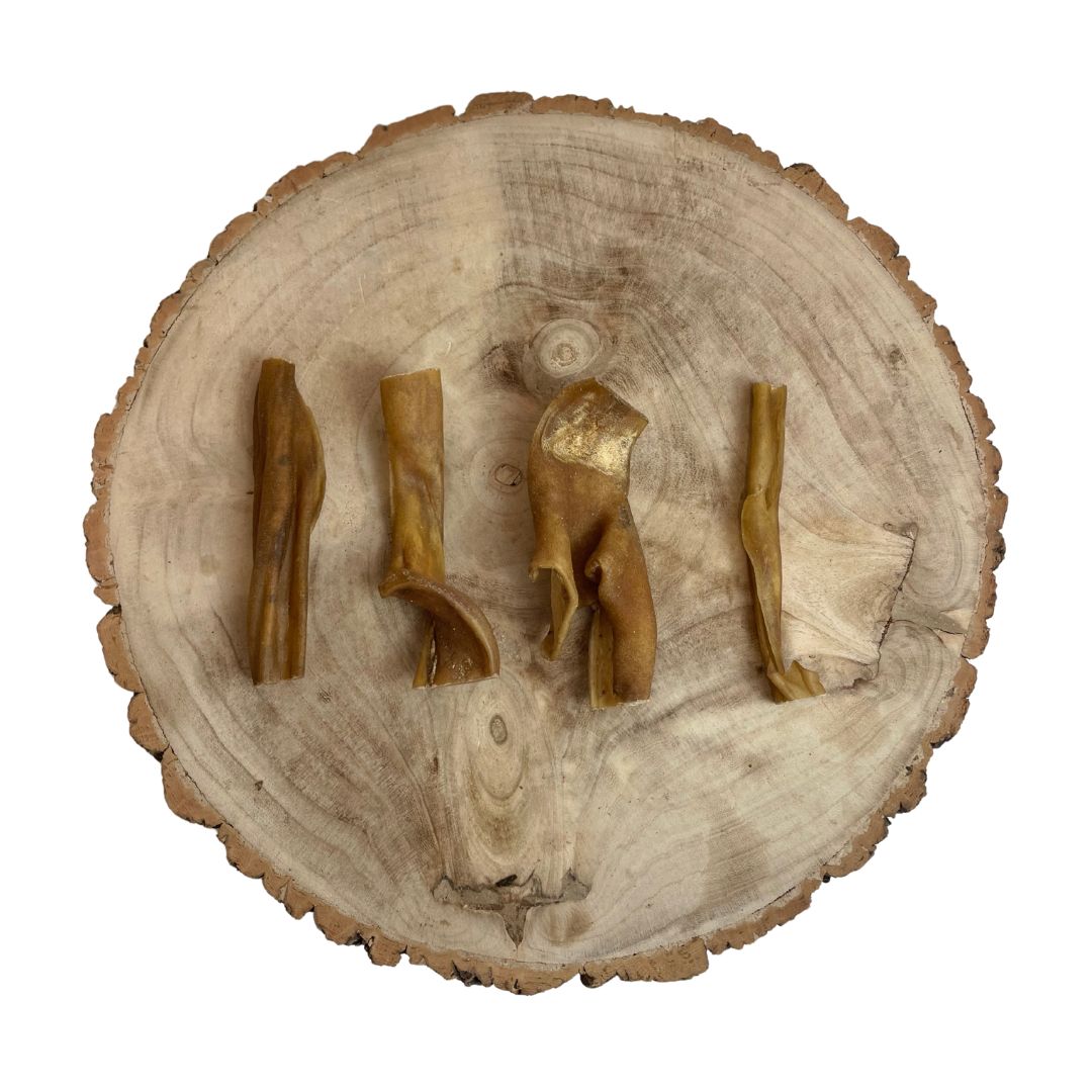 Four all natural dried buffalo skin sections on a wooden background