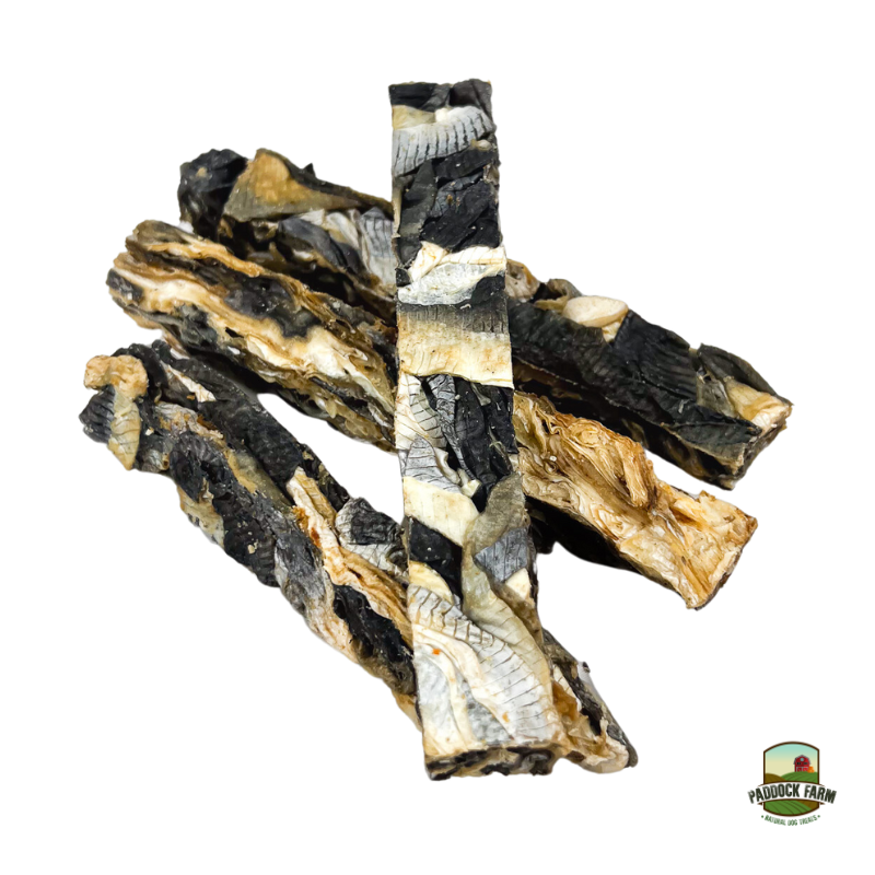 Four dried fish finger dog chews on a plain white background