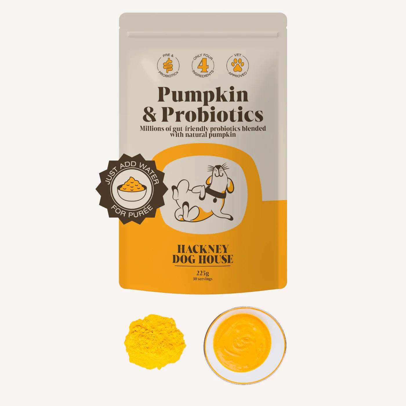 Front view of a packet/ pouch of natural pumkin and probiotics powder to make a puree for dogs on a plain white background. WIth below a heap of the powder on the left and to the right a puree in a circle. 