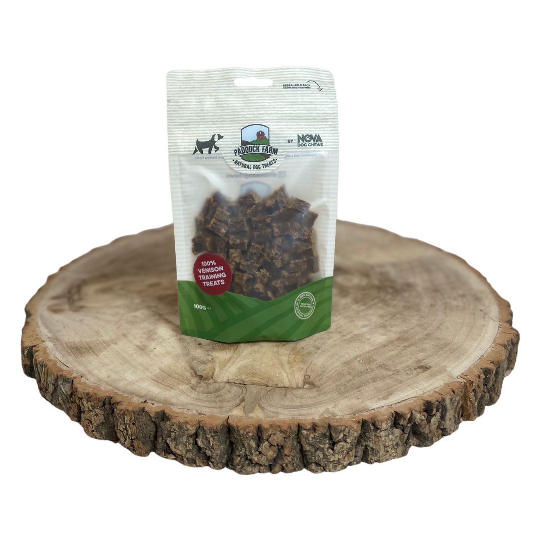A bag of natural venison training treats on a wooden background