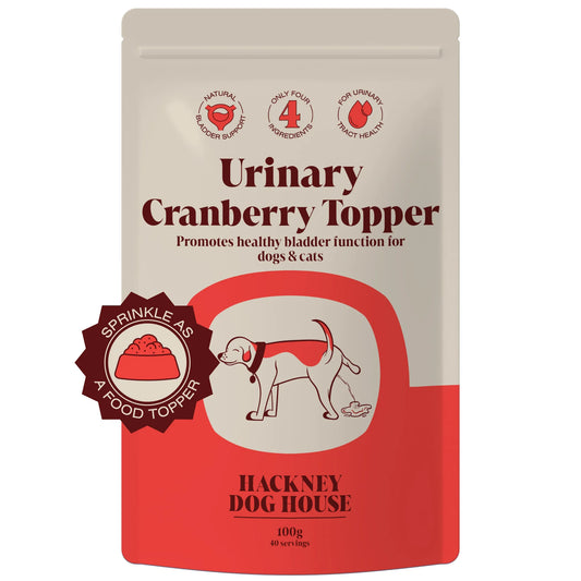 Front veiw of a packet/ pouch of urinary cranberry topper to promote healthy bladder function for dogs & cats on a plain white white background 