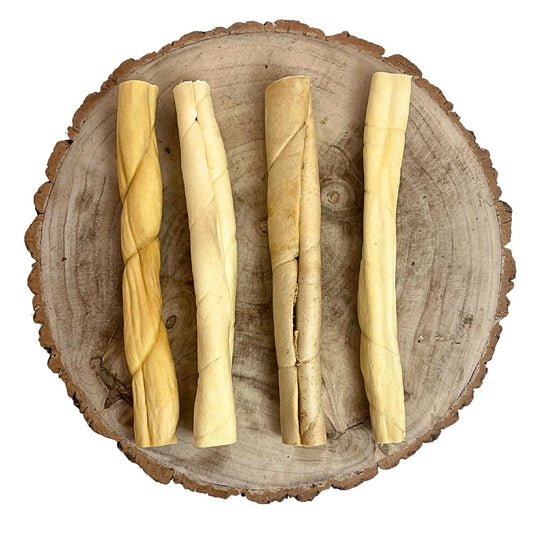 Four all natural beef skin rolls on a wooden background