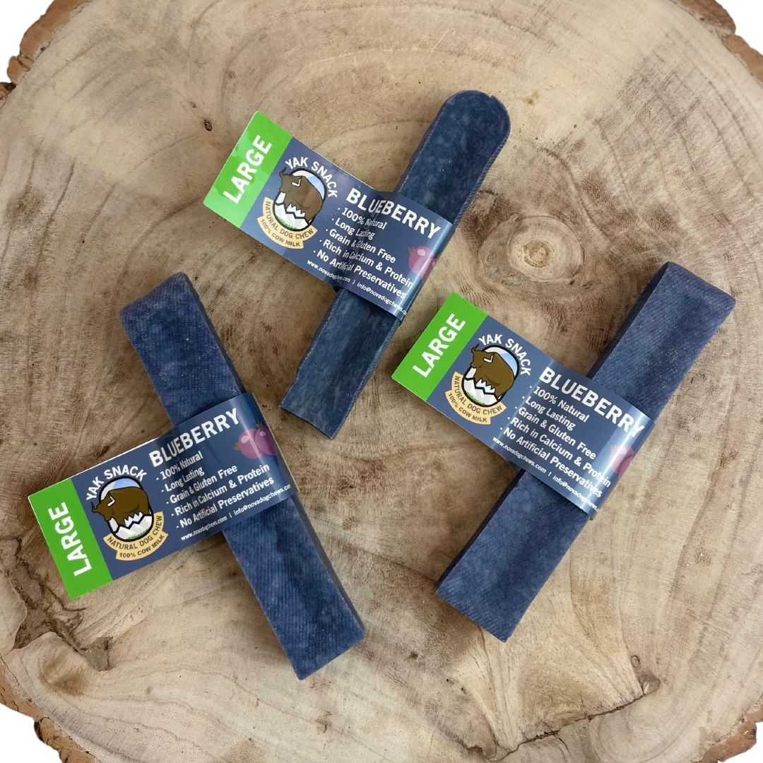 All natural yak milk chews blueberry flavour on a wooden background 