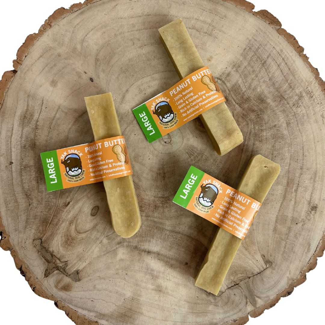 All natural yak milk chews penut butter flavour on a wooden background 