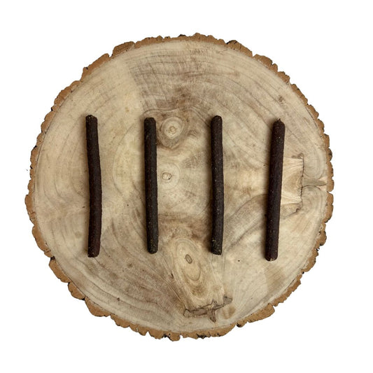 Four all natural liver meaty sticks on a wooden background