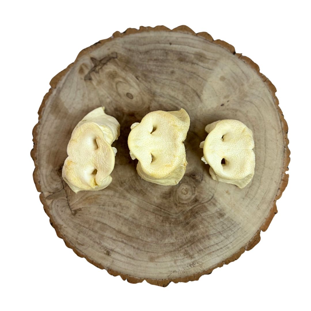 Three all natural puffed pig snouts on a wooden background