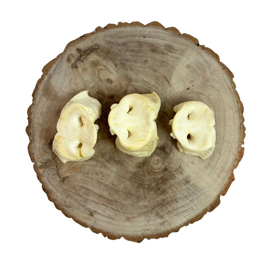 Three all natural puffed pig snouts on a wooden background
