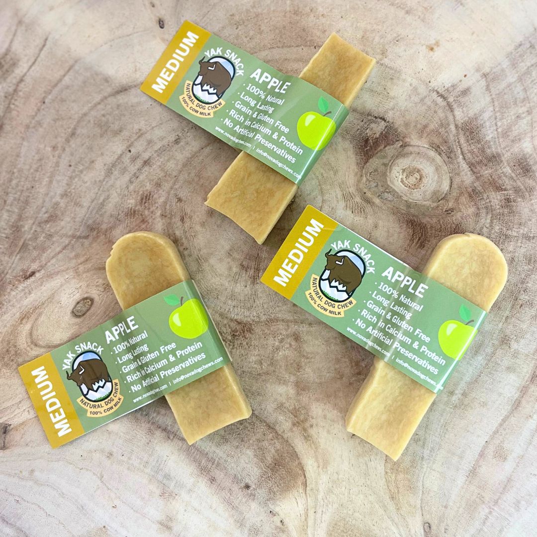 All natural medium yak milk chews apple flavour on a wooden background 