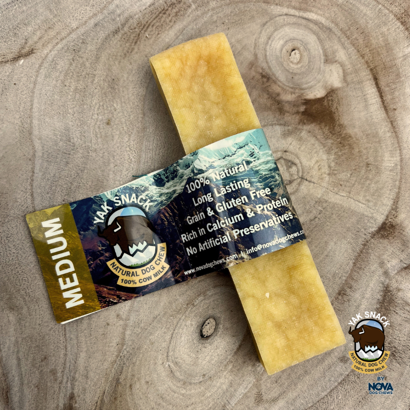 All natural medium yak milk chews Plain natural flavour on a wooden background 