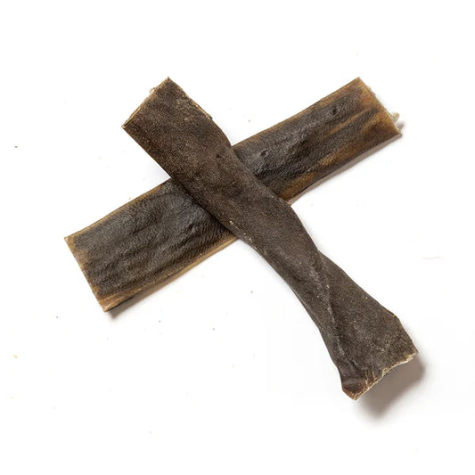 All natural dried venison skins on a white background